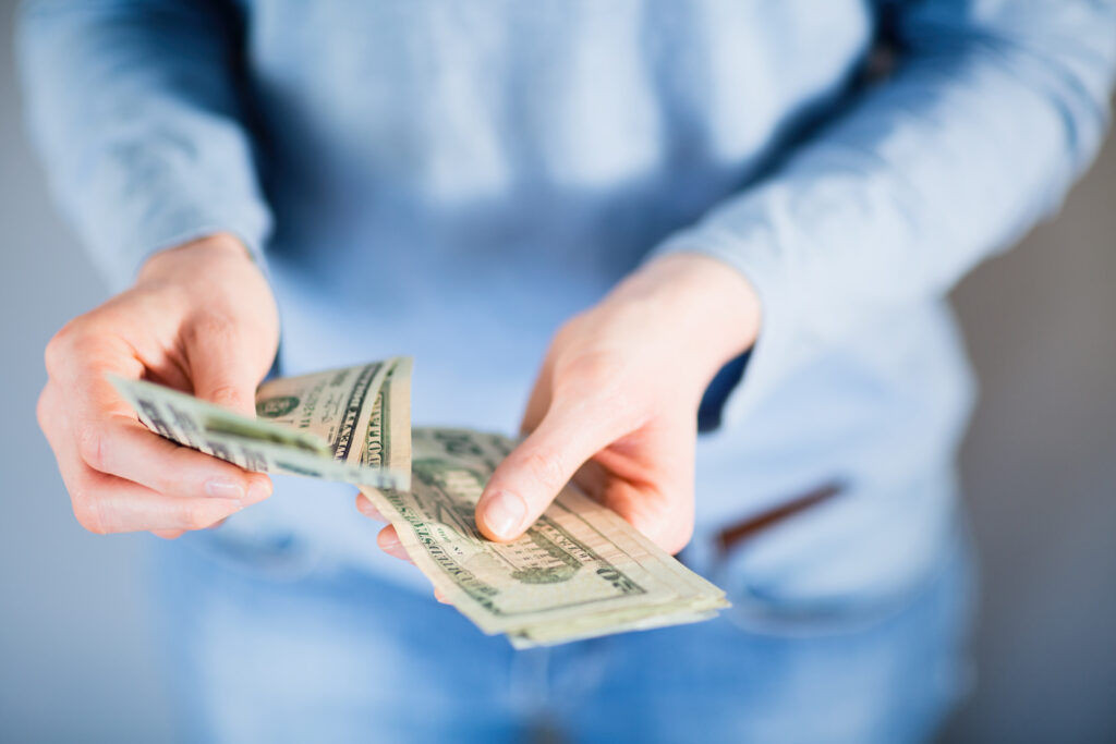 Homeowner comparing a cash offer vs listing with a realtor in Lafayette LA